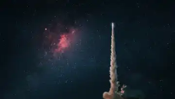 Space rocket launch into the starry sky. Space shuttle with blast and blast lift off into space on a dark background. Successful start, concept. Beginning of the Mars and Lunar mission