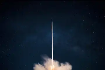 Space rocket launch into the starry sky. Space shuttle with blast and blast lift off into space on a dark background. Successful start, concept