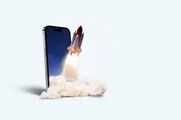 Space rocket takes off from mobile device with smoke, creative idea. Application and optimization, concept. Acceleration and successful startup. Launch