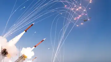 Air defense launching missiles and repelling a combat strike of missiles and drones, concept. Air defense and protection. Rocket lift off strike. War and weapons