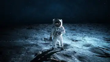 Lonely astronaut walks on the lunar surface. Lunar mission and exploration. Space man on the moon