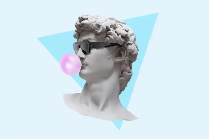 Cool hipster statue bust with fashion sunglasses blows a bubble gum on a blue triangle background with a yellow. Creative idea and modern art. Marketing, concept