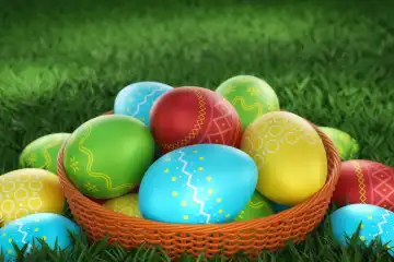 The wicker plate with Easter eggs in green grass. Colorful and decorated symbols of spring celebration. Selective focus, 3d render.