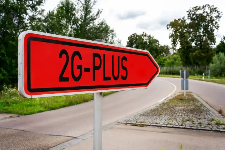 Traffic sign reading 2G Plus, Vaccinated and recovered with additional testing or booster vaccination, German Covid-19 Coronavirus Protection Regulation