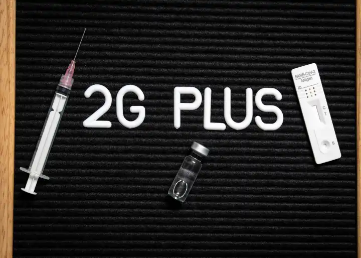 2G Plus Rule on a Letterboard with Syringe and Rapid Test, Vaccinated Convalescent with Additional Test, Covid 19 Coronavirus Protective Measure 2G Rule