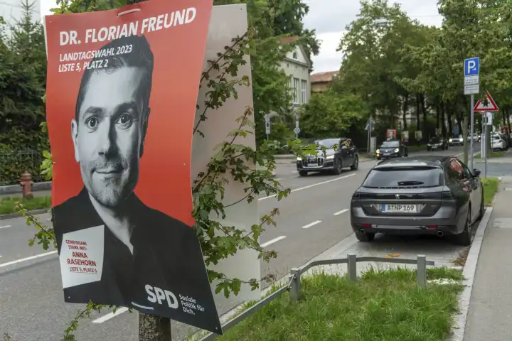 Augsburg, Bavaria, Germany - 31 July 2023: Election posters for the 2023 state election in Bavaria hang on trees in Augsburg city center. Election poster SPD (Social Democratic Party of Germany) Dr. Florian Freund
