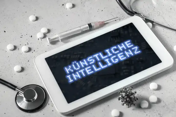 Bavaria, Germany - 19 August 2023: Computer tablet with syringe, stethoscope and medicine. Artificial intelligence in the medical field concept. Tablet with the inscription: Artificial intelligence on the screen PHOTOMONTAGE