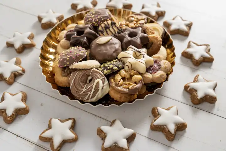 Bavaria, Germany - 29 August 2023: mixed cookies for Christmas. Christmas cookies in a disposable golden plate