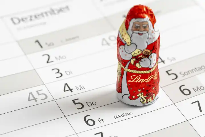 Augsburg, Bavaria, Germany - 29 August 2023: Santa Claus Day on a calendar with chocolate Santa Claus from Lindt. St. Nicholas Day on December 6