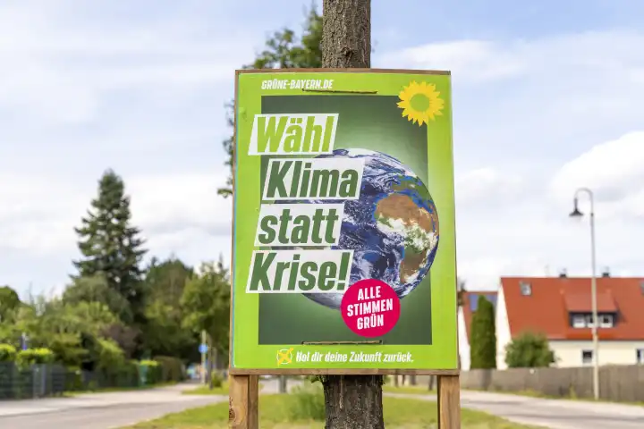 Stettenhofen, Bavaria, Germany - 31 August 2023: An election poster for the state election in Bavaria hangs on the street in a village. The party the Greens advertise with the slogan: Vote climate instead of crisis