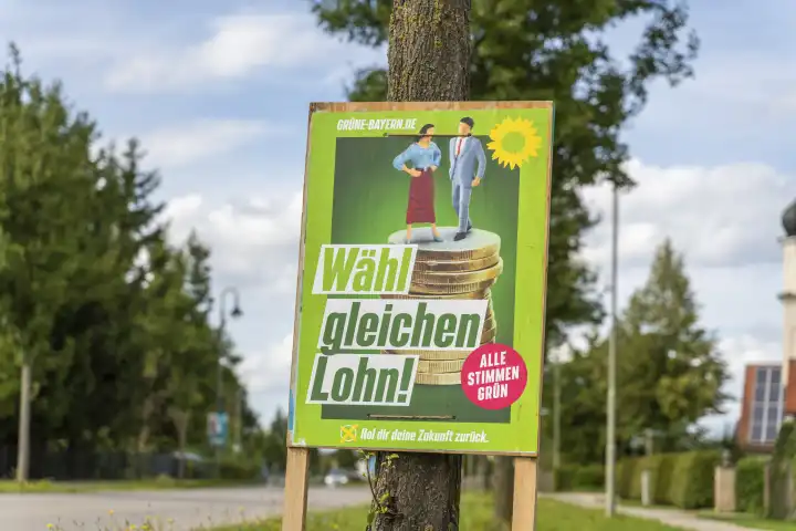 Stettenhofen, Bavaria, Germany - 31 August 2023: An election poster for the state election in Bavaria hangs on the street in a village. The party die Grünen advertise with the slogan: Vote equal pay!