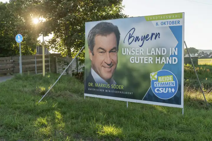Gablingen, Bavaria, Germany - 7 September 2023: Election poster for the state election in Bavaria from the CSU party with the Prime Minister of the Free State of Bavaria Dr. Markus Söder. Poster on the roadside of Gablingen in Bavaria