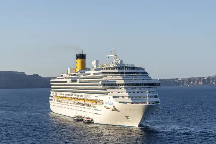 Santorini, Greece - 20 September 2023: The cruise ship of the shipping company Costa (Carnival Corporation & plc) Costa Pacifica in the sea in Greece off Santorini