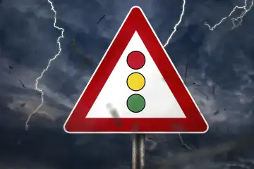 7 October 2023: Controversy and disunity in the traffic light government in Germany. Traffic sign with a traffic light during thunderstorm PHOTOMONTAGE