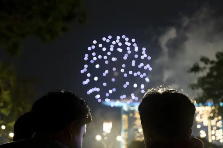 Singapore, Singapore, Asia - December 31, 2023: New Year's Eve and New Year in Singapore Asia people celebrate the New Year 2024 with fireworks in front of the Marina Bay Sands