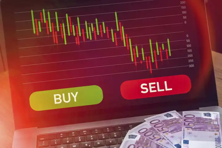 Laptop Computer mit Aktien Chart auf rotem Verkaufen Signal neben grünem Kaufen Signal. Symbolbild für Handel und Verluste von Aktien und ETF FOTOMONTAGE