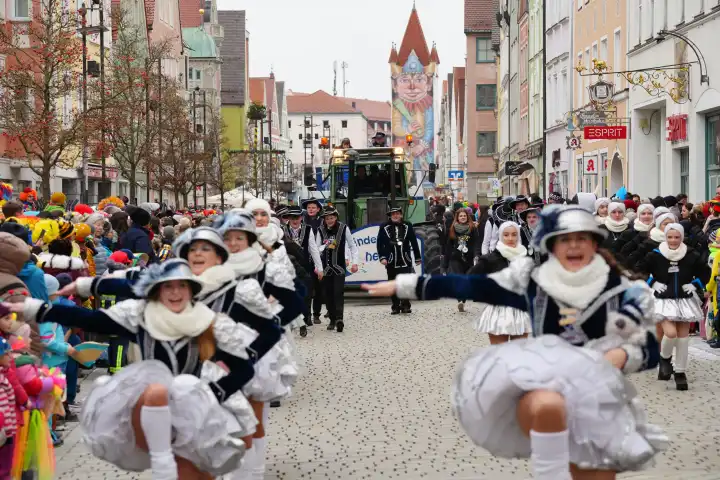 Mindelheim, Bavaria, Germany - February 8, 2024: Big carnival parade on Gumpigen Donnerstag in the city center of Mindelheim. Carnival floats and dance guards march through the crowd