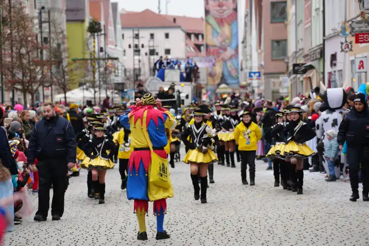 Mindelheim, Bavaria, Germany - February 8, 2024: Big carnival parade on Gumpigen Donnerstag in the city center of Mindelheim. Carnival floats and dance guards march through the crowd