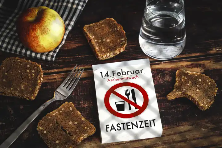 February 13, 2024: Lent, calendar with inscription February 14 Ash Wednesday, Lent next to bread and water behind bars. PHOTOMONTAGE