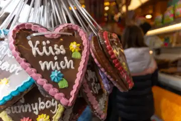 Schwabmünchen, Bavaria, Germany - March 17, 2024: Gingerbread heart with the inscription, Kiss me, at a folk festival at a confectionery stand