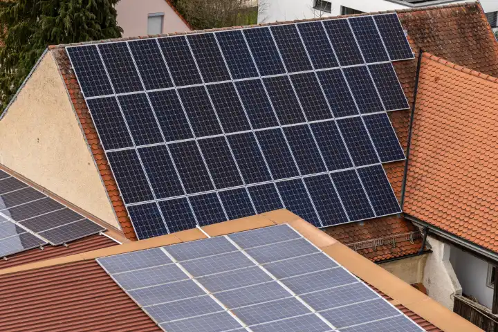 Schwabmünchen, Bavaria, Germany - March 17, 2024: Aerial view of roofs with a PV system. Photovoltaics on roof