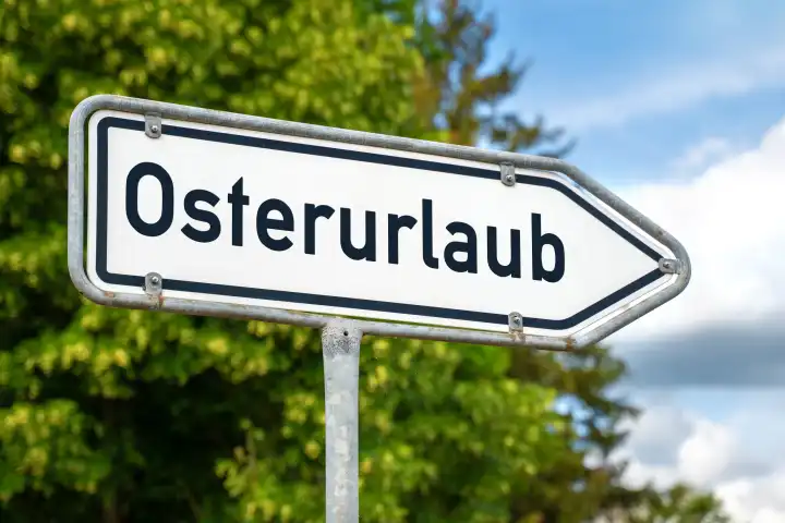 Osterurlaub, Schriftzug auf einem Schild Wegweiser. FOTOMONTAGE 