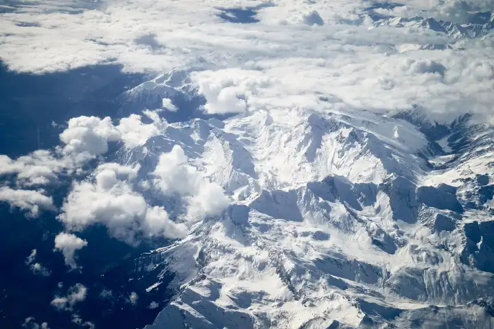 4 March 2024: Aerial view of the snow-covered mountains in the Alps