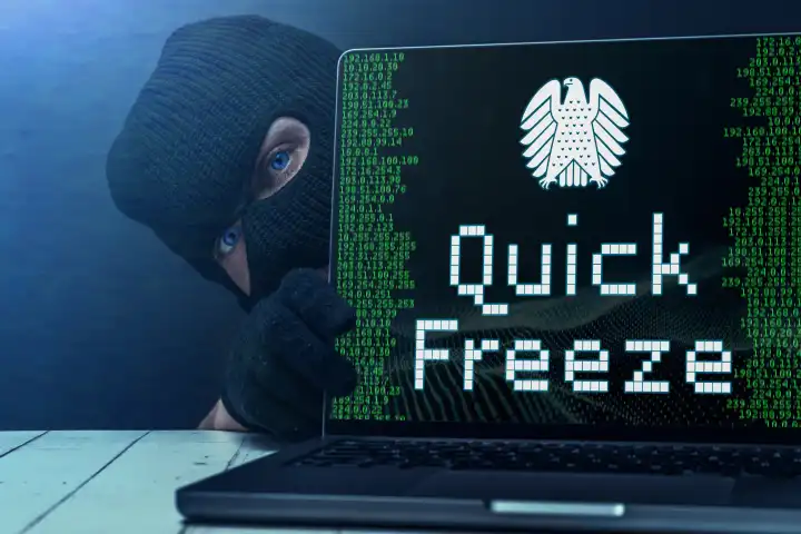 10 April 2024: Symbolic photo of the quick freeze procedure instead of data retention. Criminal sitting in front of laptop with IP addresses, the federal eagle and the words: Quick Freeze. PHOTOMONTAGE