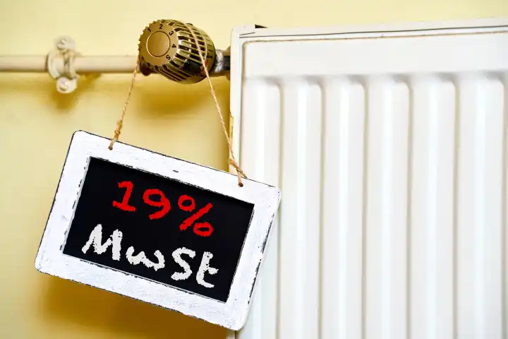16 April 2024: Sign on a radiator with the inscription: 19% VAT. VAT on gas and oil. PHOTOMONTAGE