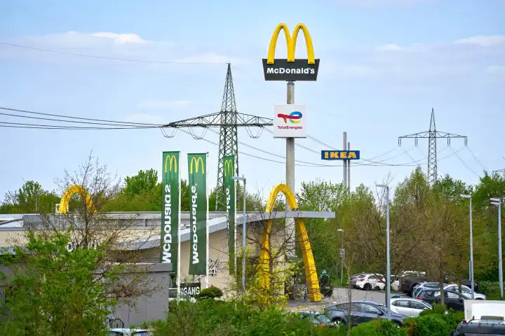 Augsburg, Bavaria, Germany - 11 April 2024: A McDonald's fast food restaurant with many cars in the parking lot