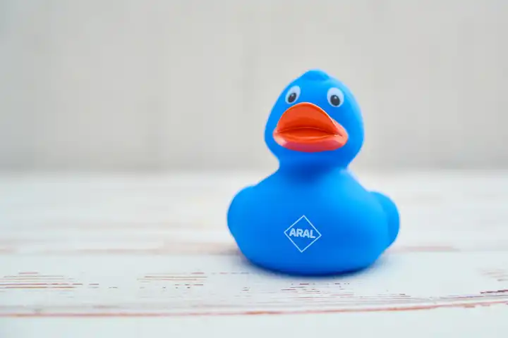 Augsburg, Bavaria, Germany - April 17, 2024: Blue rubber duck with ARAL logo. Promotional gift