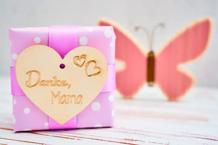 Augsburg, Bavaria, Germany - April 17, 2024: Gift with a heart and the inscription: Thank you mom! Happy Mother's Day