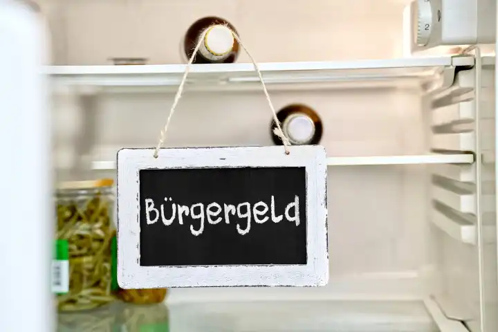 22 April 2024: Sign in an empty fridge with the words: Bürgergeld. PHOTOMONTAGE