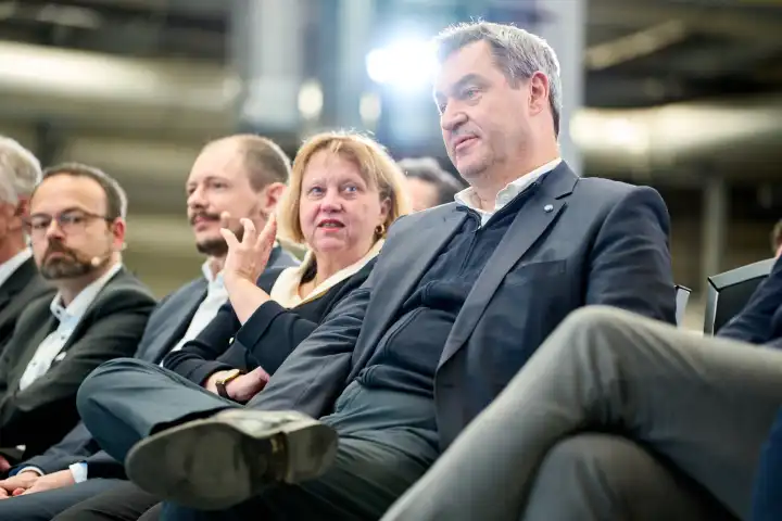 Augsburg, Bavaria, Germany - 24 April 2024: Prime Minister of Bavaria Dr. Markus Söder visits the presentation of the AI Network Augsburg. AI research hall ("Hall 43") of the University of Augsburg. Sitting in the audience with a serious look