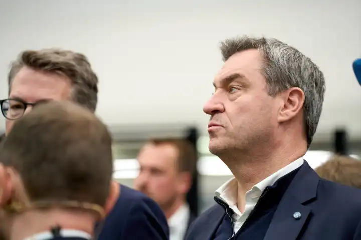 Augsburg, Bavaria, Germany - 24 April 2024: Prime Minister of Bavaria Dr. Markus Söder visits the presentation of the AI Network Augsburg. AI research hall ("Hall 43") of the University of Augsburg. Portrait with a serious look