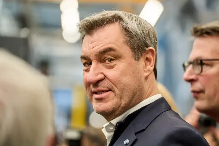 Augsburg, Bavaria, Germany - 24 April 2024: Prime Minister of Bavaria Dr. Markus Söder visits the presentation of the AI Network Augsburg. AI research hall ("Hall 43") of the University of Augsburg. Portrait smiling