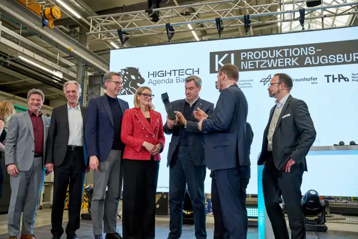 Augsburg, Bavaria, Germany - 24 April 2024: Minister President of Bavaria Dr. Markus Söder visits the presentation of the AI Network Augsburg of the University of Augsburg. With him on stage Minister of State Markus Blume and Lord Mayor Eva Weber
