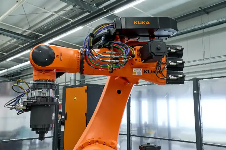 Augsburg, Bavaria, Germany - April 24, 2024: Kuka industrial robots on display in the AI research hall ("Hall 43") of the University of Augsburg