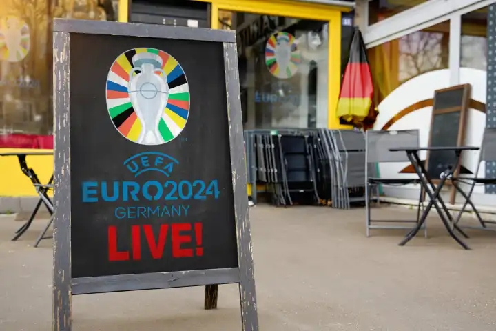 25 April 2024: Symbolic photo Public Viewing of the UEFA EURO 2024 European Football Championship, sign in front of a restaurant with inscription: UEFA EURO 2024 Germany Live!  PHOTOMONTAGE