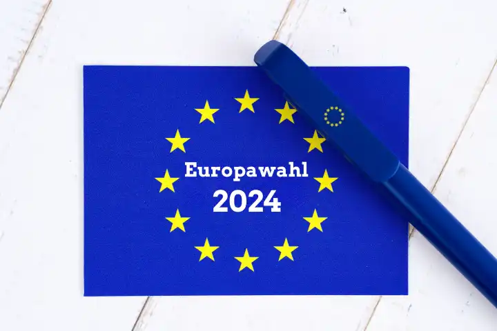 Symbolfoto Europawahl, EU Flagge mit EU Kugelschreiber und dem Schriftzug: Europawahl 2024. FOTOMONTAGE