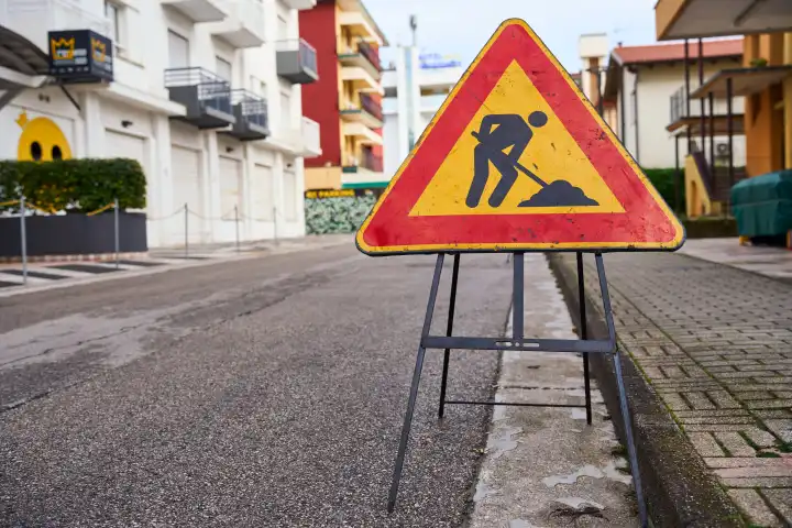 Lido di Jesolo, Italy - 2 May 2024: Warning sign on a road in Italy, construction site