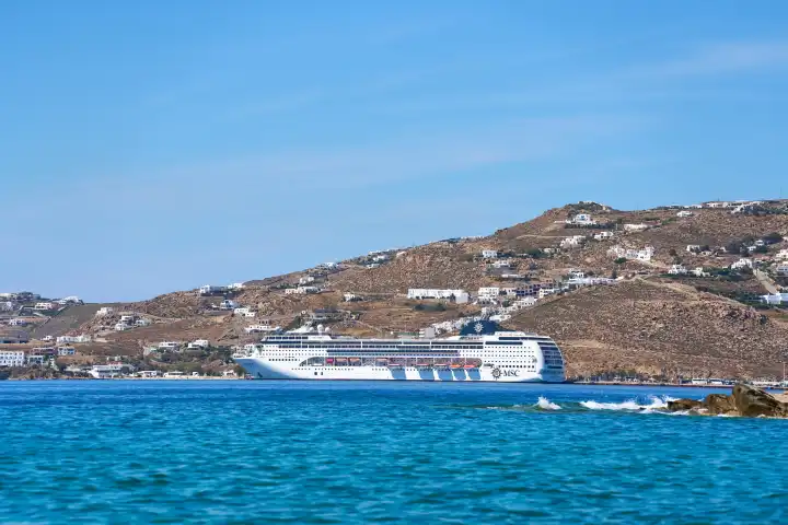 Mykonos, Greece - 7 May 2024: Cruise ship MSC Lirica of the Mediterranean Shipping Company at sea off Mykonos in Greece