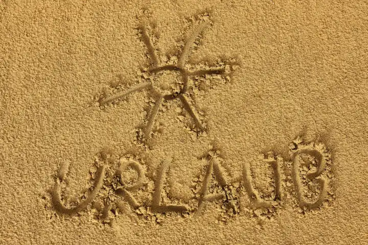 Urlaub - geschrieben in Sand. Das Wort: Urlaub, am Strand
