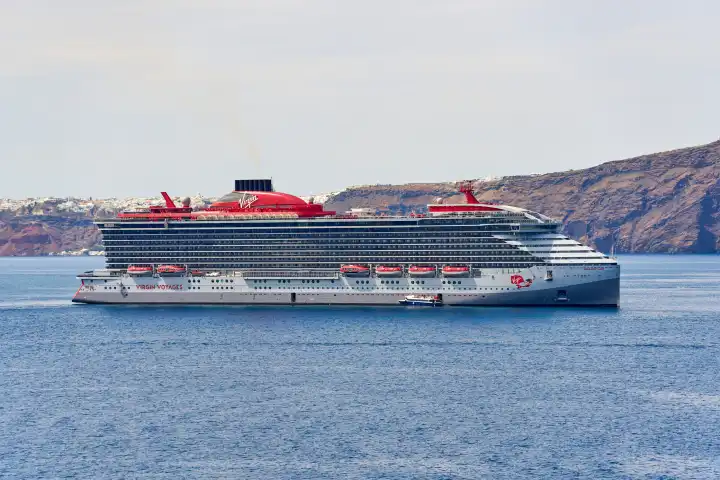 Santorini, Greece - May 8, 2024: Ship Resilient Lady cruise ship of the shipping company VIRGIN VOYAGES off the island of Santorini in Greece