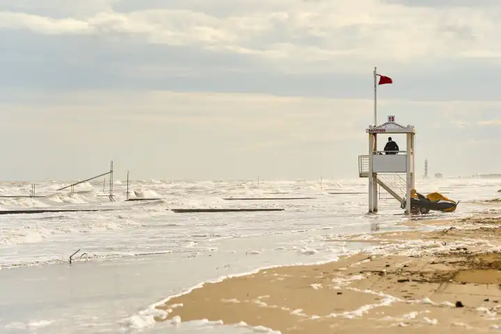 Lido di Jesolo, Italy - 2 May 2024: Red flag at the sea or beach of Lido di Jesolo. Swimming ban due to storms in the sea