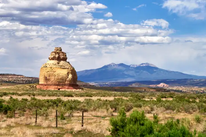 Highway 191, Utah, United States of America - 7 June 2024: Church Rock, an impressive sandstone formation in Utah near U.S. Route 191 and the entrance to Canyonlands National Park, reaches 1881 meters and forms a spectacular backdrop with the Abajo Mountains