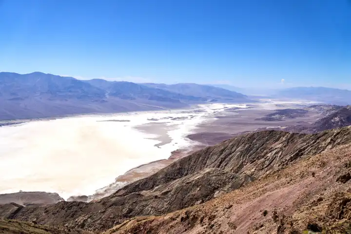 Death Valley National Park, California, United States of America - June 10, 2024: View of Death Valley in the USA, an impressive desert landscape with mountain ranges and an extensive salt lake, known for its extreme dryness and heat