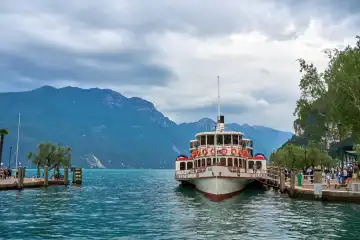  Riva del Garda, Lake Garda, Italy - June 24, 2024: The ferry of the Italian passenger transport on Lake Garda also called Battello in Riva del Garda offers tourists the opportunity to visit several villages on the lake