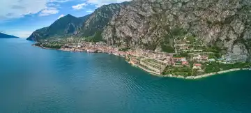  Limone sul Garda, Lake Garda, Italy - June 26, 2024: Aerial view of the town of Limone sul Garda on the shores of Lake Garda in Italy. View of the town surrounded by mountains and crystal clear waters of Lake Garda