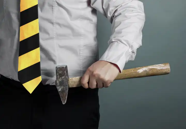 Businessman with Hammer in Hand and Working Zone Black and Yellow Stripes Cravat